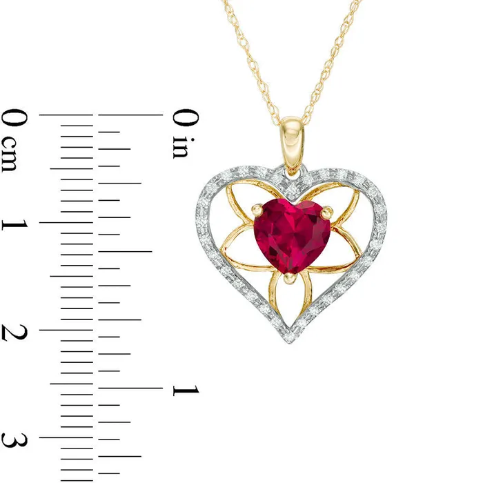 70mm HeartShaped LabCreated Ruby and 013 CT TW Diamond Floral Heart Pendant in 10K Yellow Gold Goldia Necklaces 70mm HeartShaped LabCreated Ruby and 013 CT TW Diamond Floral Heart Pendant in 10K Yellow Gold Goldia Necklaces
